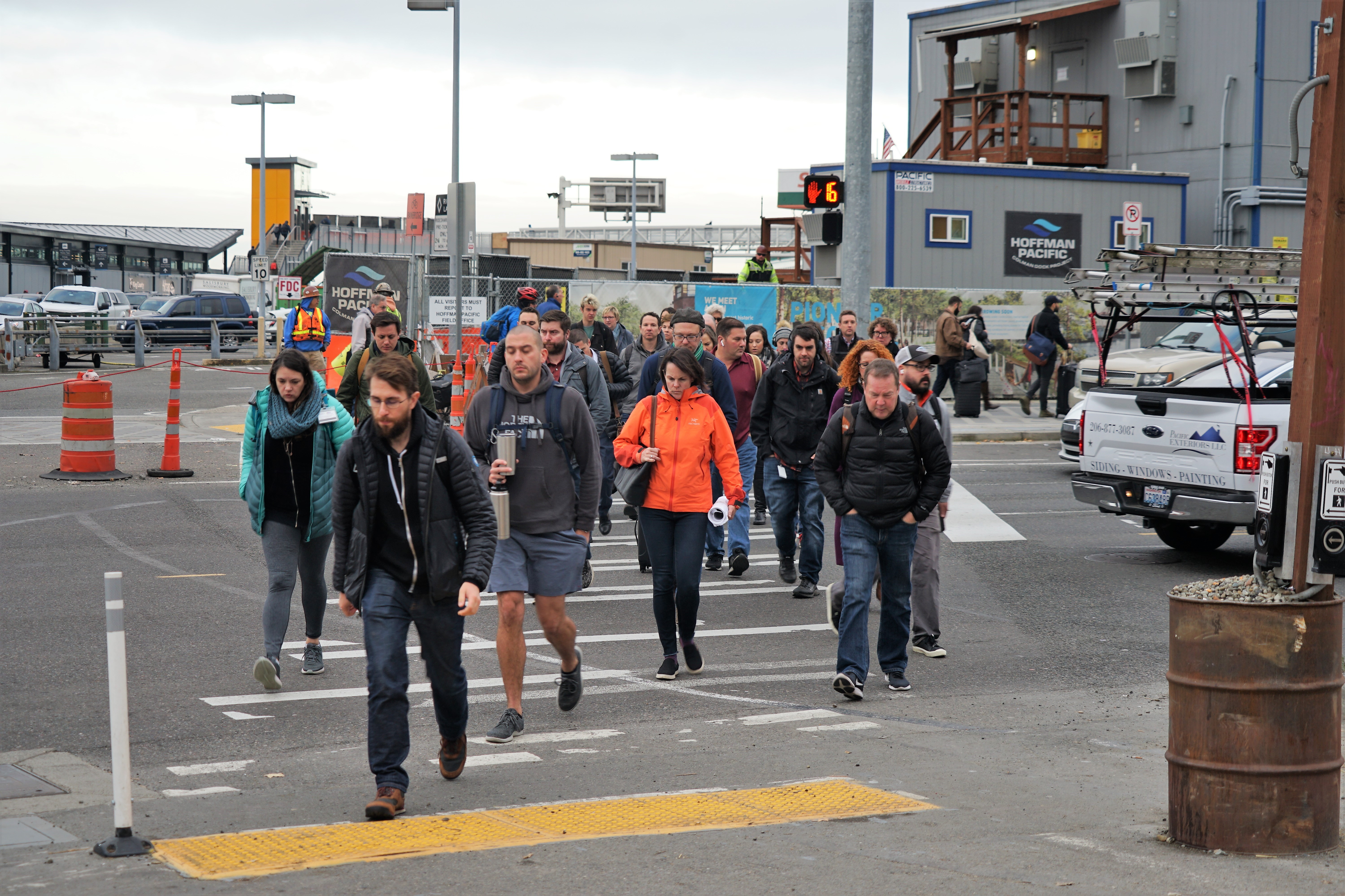 People crossing a crosswalk on Alaskan Way