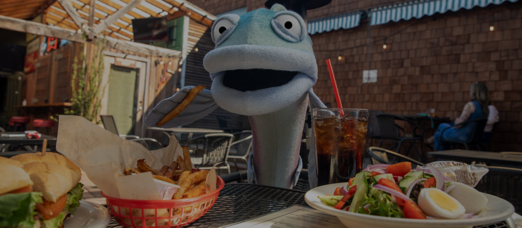 Sal the Salmon enjoying a local restaurant in Seattle
